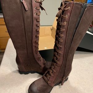 Women’s size 8 Sorel tall boots.
